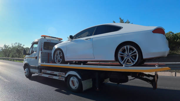 a truck loaded with vehicle