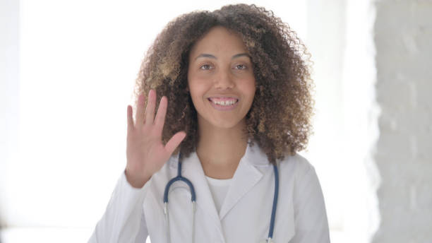 istock Talking Afrcian Doctor Doing Video Chat at Clinic 1423327922
