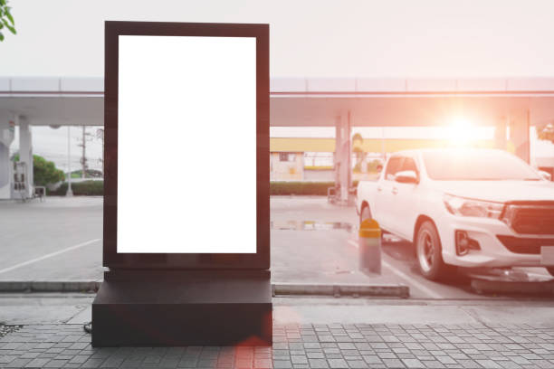 istock Blank billboard mockup at empty parking lots outdoors. Advertising, public information board concept. 1423328027