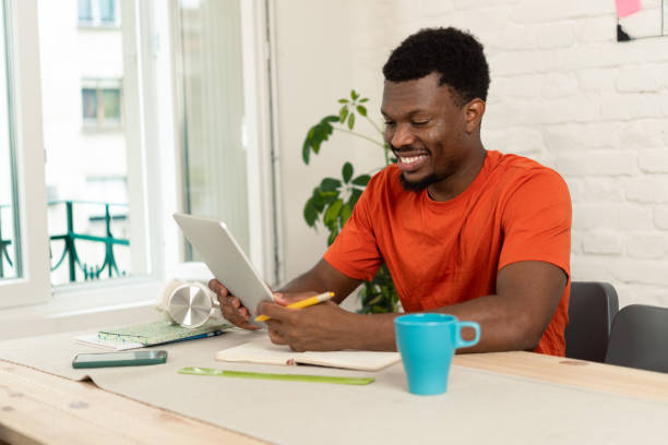 istock Young man studying in his room 1423330724