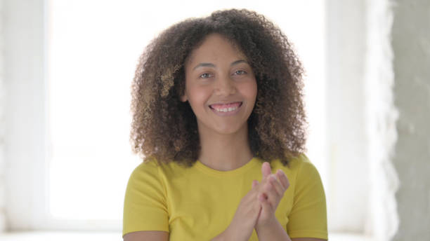 istock Happy African Woman Clapping, Applauding 1423331033