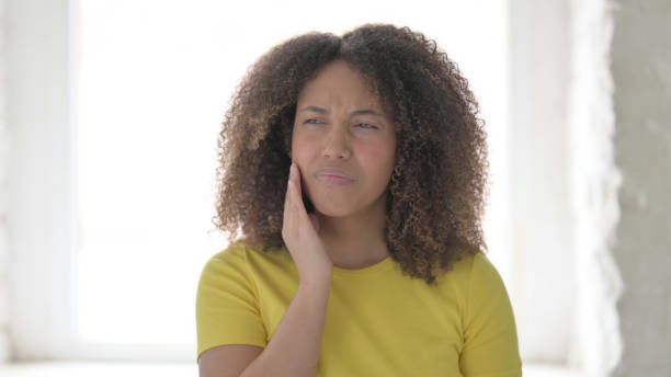 istock Sick African Woman having Toothache 1423332391