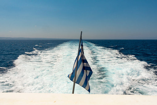 Greek flag at the back of a ferry
