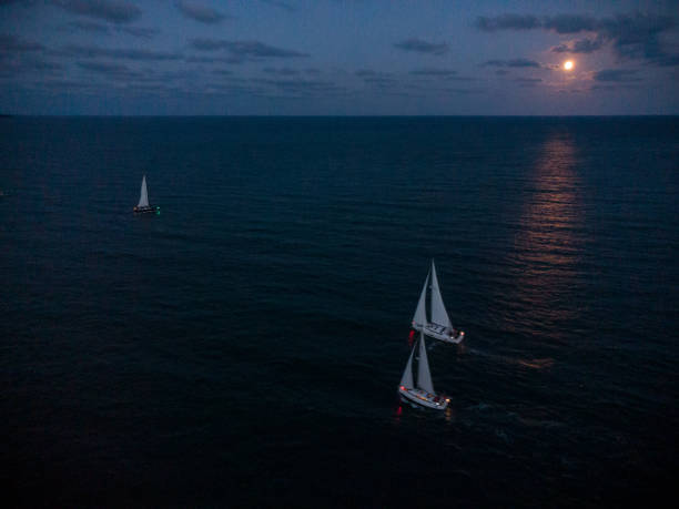 istock Luxury yachts at Sailing regatta at fool moon night. 1423334878