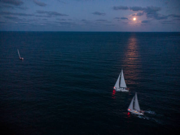 istock Luxury yachts at Sailing regatta at fool moon night. 1423334880