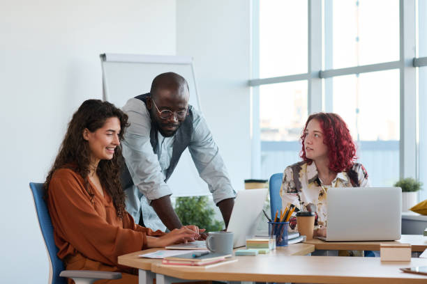 istock Group of young successful intercultural managers preparing presentation 1423335127