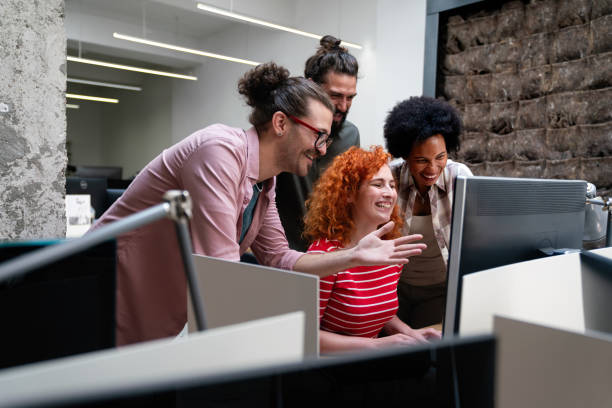 istock Smiling diverse colleagues gather in boardroom brainstorm discuss financial statistics together 1423335758