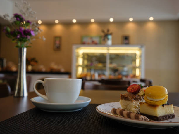 istock breakfast with delicious cake and coffee in a cafe 1423337994