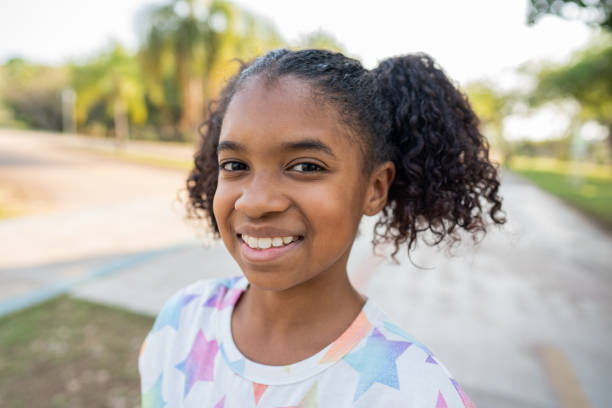 istock Portrait of a smiling child looking at camera 1423340370
