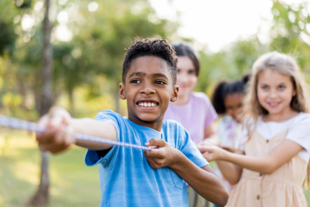 istock Children playing tug of war 1423340464