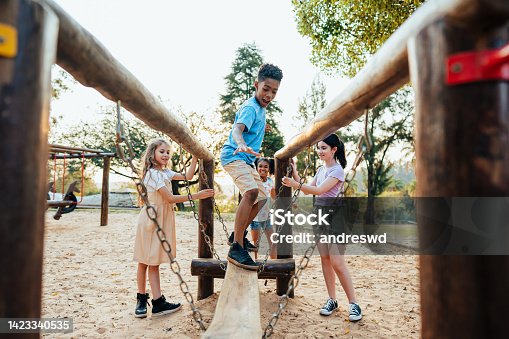istock Children playing in the playground 1423340535