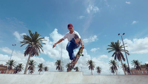 istock Skateboarder doing a trick in a skate park 1423341852