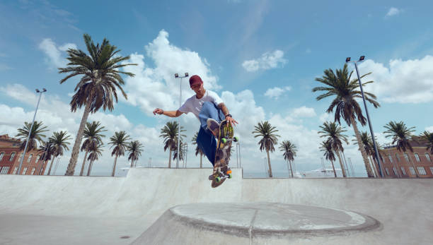 istock Skateboarder doing a trick in a skate park 1423341858
