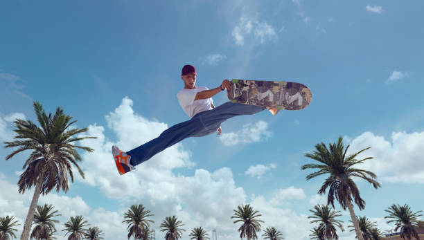 istock Skateboarder doing a trick in a skate park 1423341873