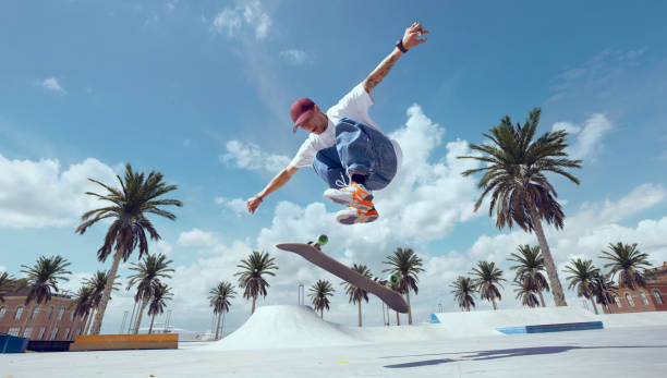 istock Skateboarder doing a trick in a skate park 1423341907