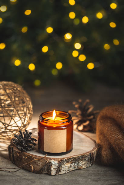istock Holiday candle in a glass jar with label mock up 1423341933