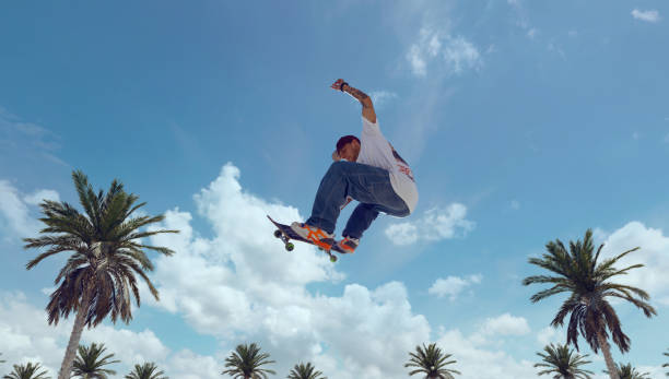 istock Skateboarder doing a trick in a skate park 1423341937