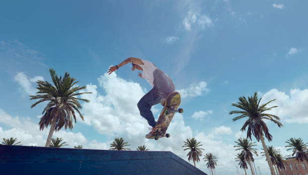istock Skateboarder doing a trick in a skate park 1423341964