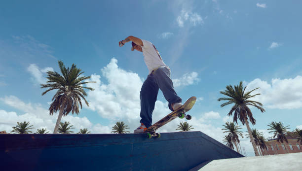 istock Skateboarder doing a trick in a skate park 1423341965