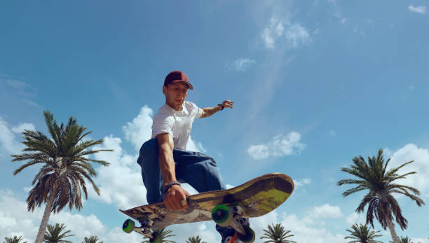 istock Skateboarder doing a trick in a skate park 1423341982
