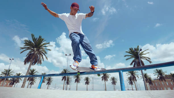 istock Skateboarder doing a trick in a skate park 1423341998