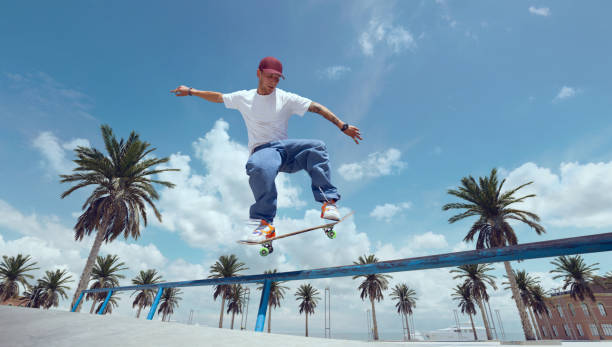 istock Skateboarder doing a trick in a skate park 1423341999