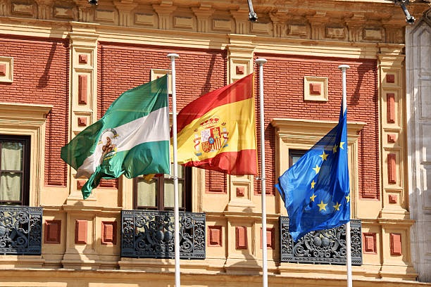 Flags at Palace of San Telmo, Seville stock photo