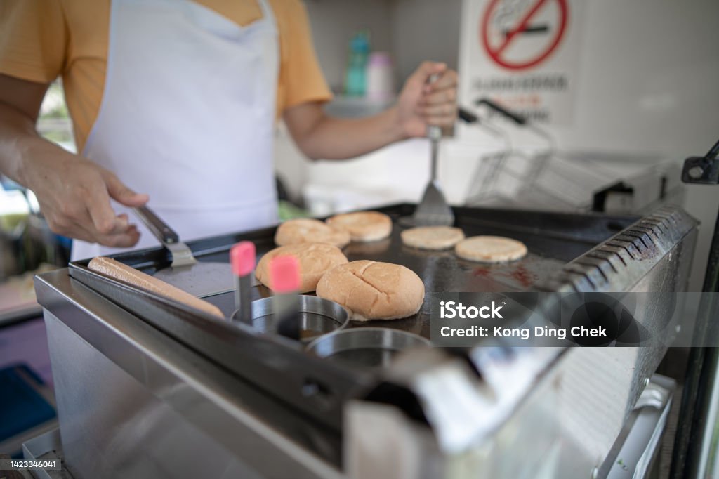 Asian Chinese owner working in food truck Adult Stock Photo