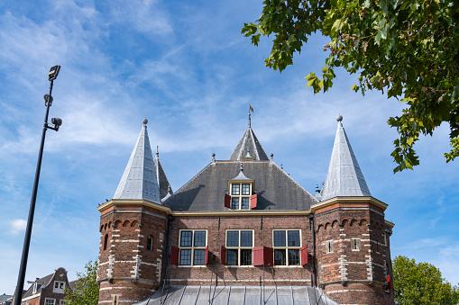 Amsterdam Waag building exterior with a blue sky in the background.