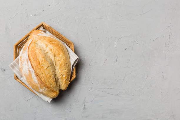 istock Freshly baked bread on basket against natural background. top view bread copy space 1423346256