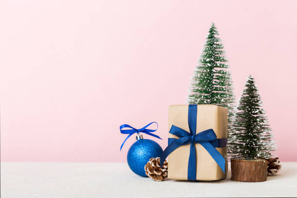 istock Christmas composition. Gifts, small tree, branches and craft DIY decorations on white background. New year concept. Christmas home decoration Flat lay, top view, copy space 1423346440