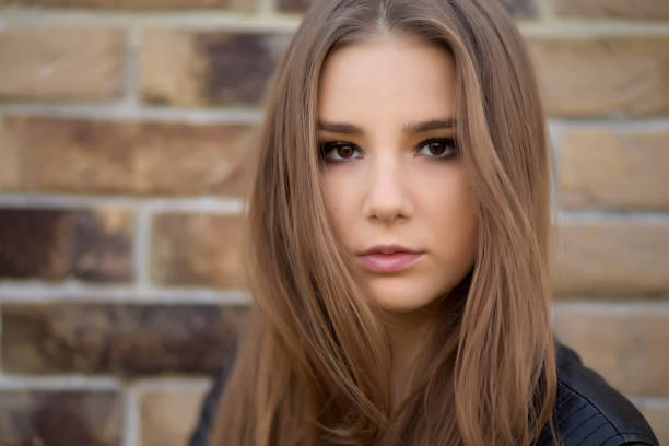sad pensive girl looking at camera