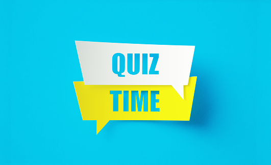 Quiz time written cut out yellow and white speech bubbles sitting on blue background. Horizontal composition with copy space.