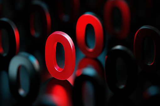 Red number zero glowing amid black numbers on black background. Horizontal composition with copy space. Standing out from the crowd concept.