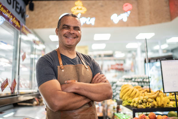 portrait of a market owner - butiksarbetare bildbanksfoton och bilder