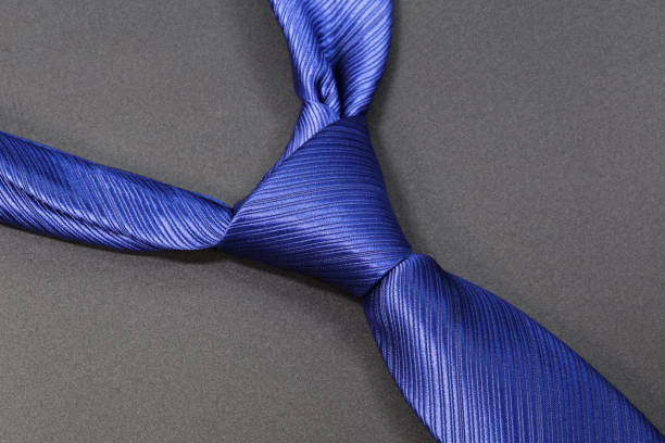 cravatta blu su sfondo grigio. - suit necktie close up gray foto e immagini stock