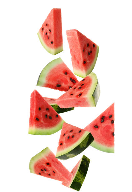istock Slices of delicious ripe watermelon falling on white background 1423352677