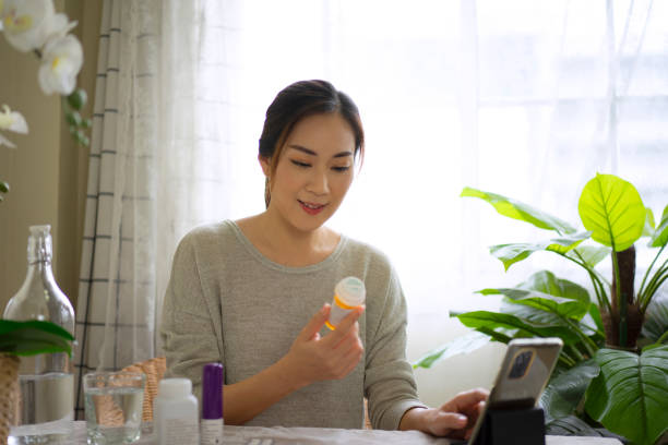 istock Woman is reading Prescription Medication Label. 1423353182