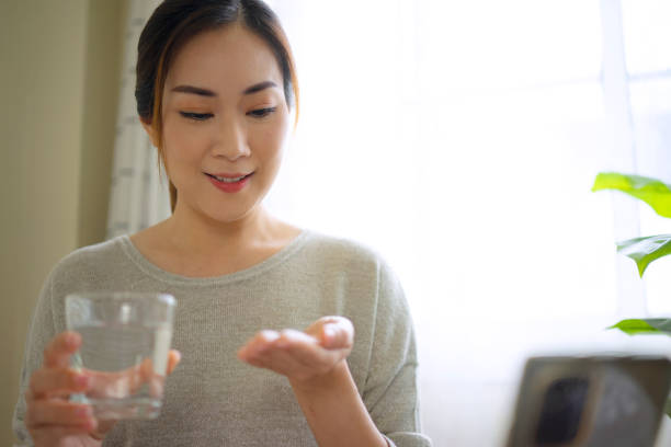 istock Woman is reading Prescription Medication Label. 1423353246
