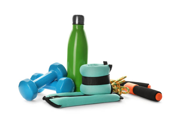 istock Stylish ankle weights and sport equipment on white background 1423353381
