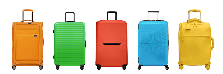 Multi colored suitcases isolated on white background