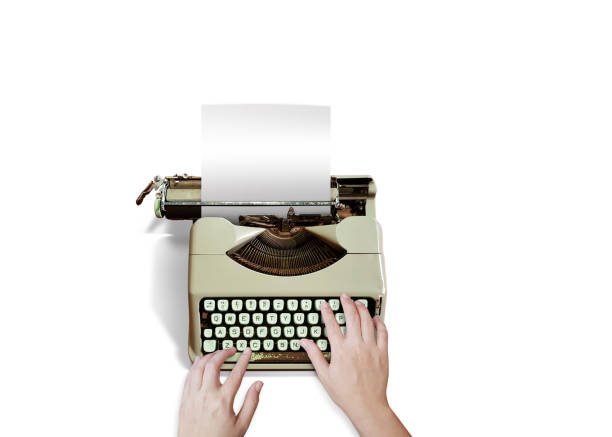 istock woman's hand typing on an old typewriter isolated on a white background 1423356590