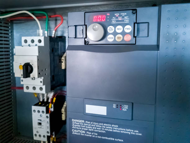 istock Frequency inverter, and circuit breaker in electrical cabinet of automation control system. 1423359583