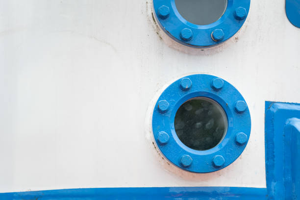 detail of blue door with round glass window