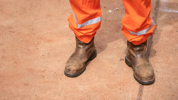 istock A construction with safety shoe standing on dirt ground. 1423360090
