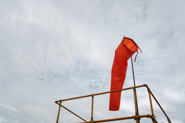 Windsock against blue sky