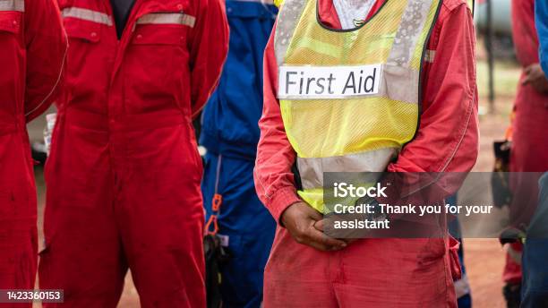 First Aid Person In Emergency Drill Stock Photo - Download Image Now - Evacuation, Healthcare And Medicine, Teamwork