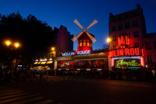 Cabaret Moulin Rouge in the Night Time in Paris Paris, France - July, 15: Cabaret Moulin Rouge in the Night Time in Paris on July 15, 2022 place pigalle stock pictures, royalty-free photos & images