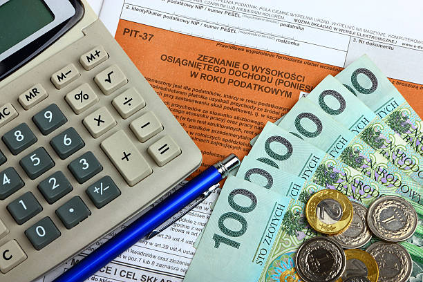 istock Tax form with calculator, money and pen 142336770