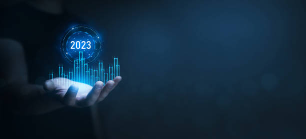 istock Businessman holding growth graph a year 2023 of business and data analysis. Development to success in year 2023. 1423368065